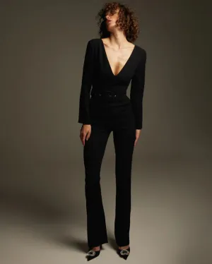 Black jumpsuit with an open back and long sleeves